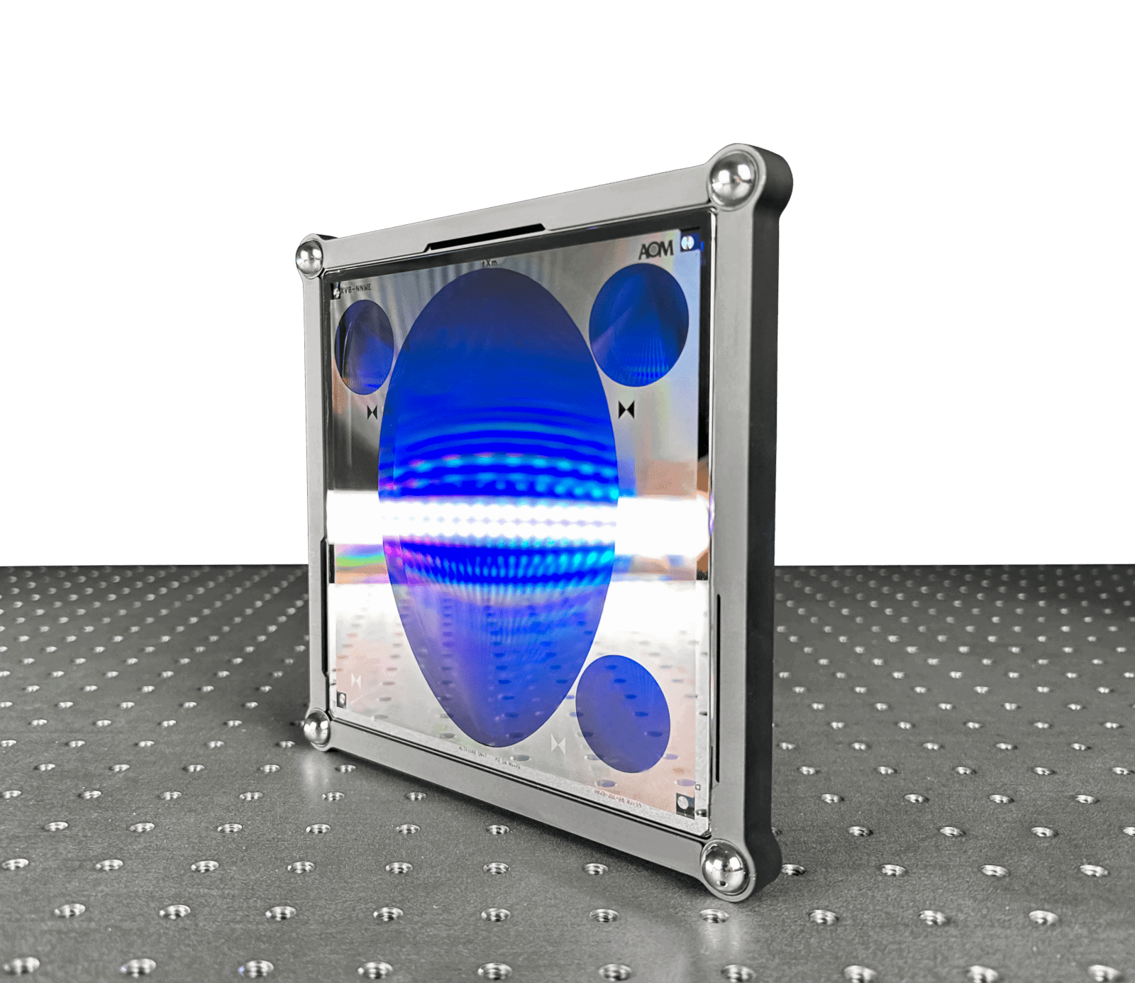 An AOM computer-generated hologram (CGH) with alignment patterns sits upright on an air table